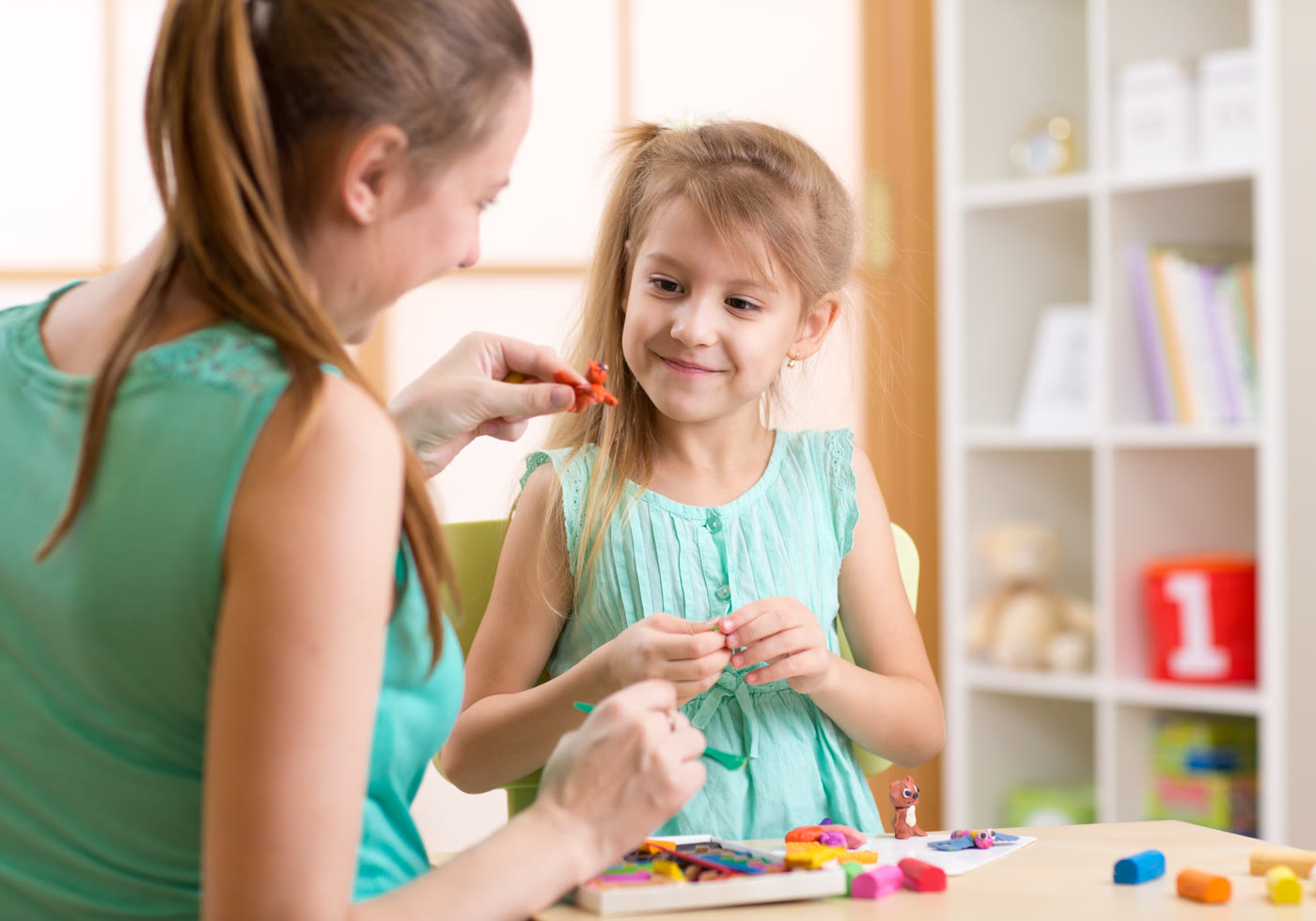 Parent and child using a hands-on modeling activity during home learning